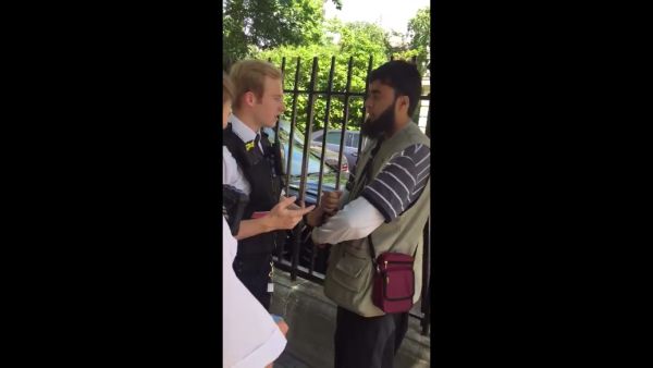 A video of a British Muslim man being handcuffed and searched after a white woman accused him of “wearing too many layers of clothes” has gone viral online (Facebook)