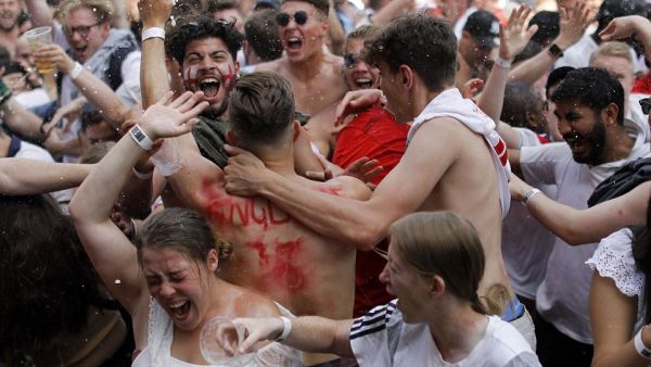 These fans in London could be seen cheering wildly and throwing beer around as Dele Alli added a second goal for England against Sweden. (AFP/ File Photo)