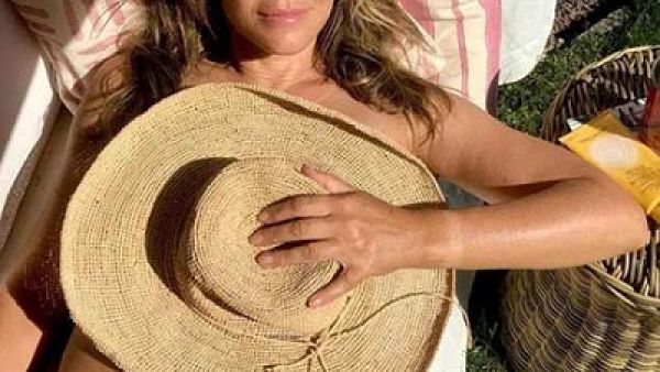 Elizabeth Hurley, 53, went topless for a sizzling snap which saw her cover her assets with an oversized fedora fat as she basked in the scorching weather. (Instagram/ Elizabeth Hurley)