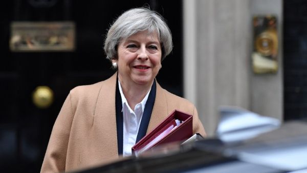 British Prime Minister Theresa May leaves 10 Downing Street before heading to the Houses of Parliament to attend the weekly Prime Minister's Questions (PMQs) in central London on March 29, 2017. (AFP/Ben Stansall)