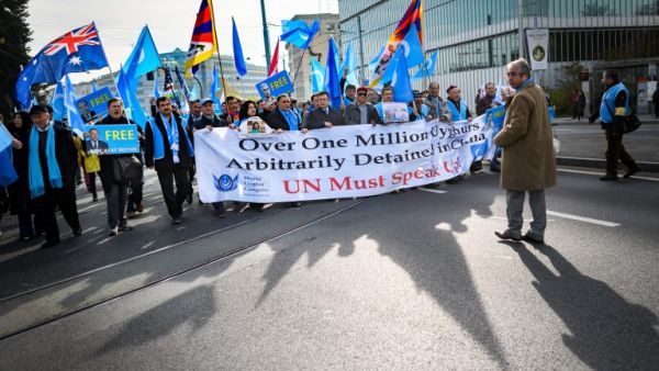 Uyghurs and Tibetan people demonstrate against China outside of the United Nations (UN) offices during the Universal Periodic Review of China by the UN Human Rights Council, on November 6, 2018 in Geneva. (Fabrice COFFRINI / AFP)