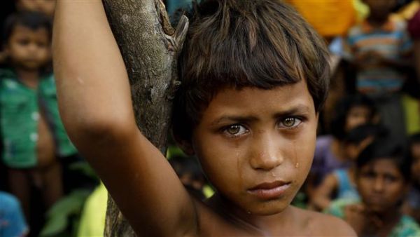 A Rohingya refugee girl is seen crying in front of newly-arrived refugees who fled to Bangladesh from Myanmar in Ukhiya. (AFP/ File Photo)