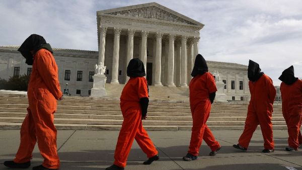 Protesters gather in front of the U.S. Supreme Court to mark 15 years since the first prisoners were brought to the U.S. detention facility in Guantanamo Bay, Cuba on January 11, 2017 in Washington, DC. (AFP/Joe Readle)