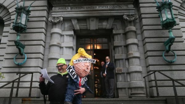 Mihael Petrelis glances at the appellate court's decision outside a federal appeals court after it ruled against lifting the stay on U.S. President Donald Trump's executive order imposing a temporary immigration ban on seven Muslim-majority nations in San Francisco, California. (AFP/Elijah Nouvelage)