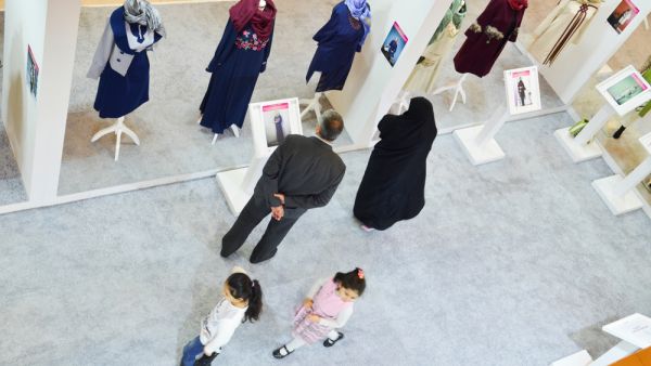 A couple is looking at clothes in Islamic fashion exhibition. (Sutterstock/File)