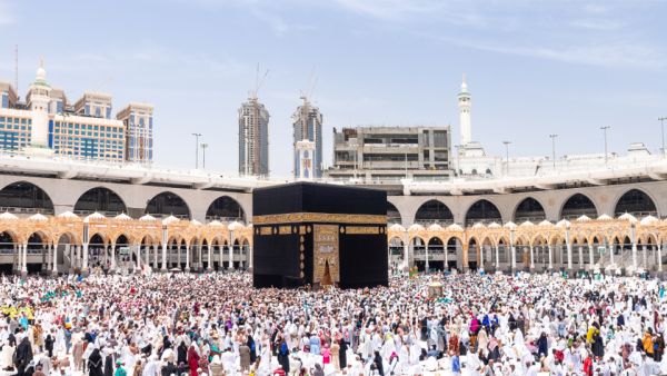 People walking around 7 circles making Tawaf, a part of Hajj and Umrah. (Shutterstock)