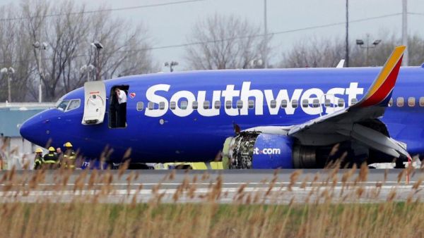 The Southwest Airlines jet sitting on the runway at Philadelphia International Airport after it was forced to land with an engine failure. (AFP/ File Photo)