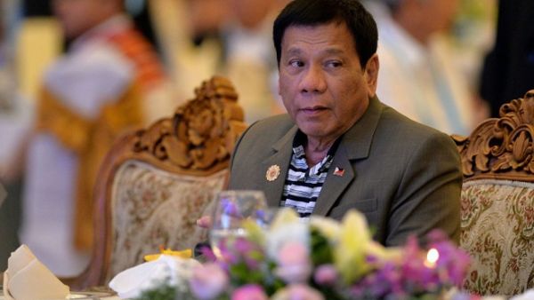 'I will eat you alive,' Philippine President Rodrigo Duterte told terrorists during an address to the Filipino community in Laos in September 2016. (AFP/Ye Aung)