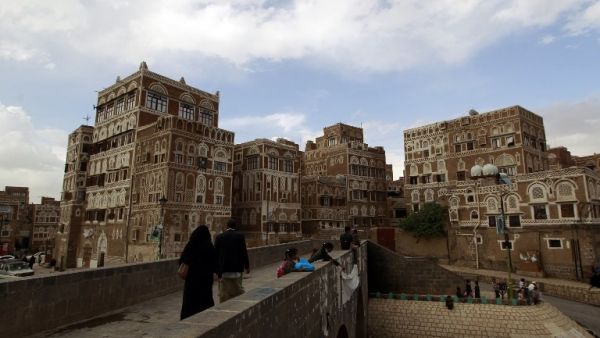 Residents walk toward the old city of Yemen's capital, Sanaa. (AFP/Mohammed Huwais) Residents walk toward the old city of Yemen's capital, Sanaa. (AFP/Mohammed Huwais)