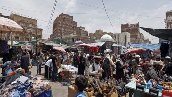 Yemenis shop at a market in the capital Sanaa on August 30, 2017, as Muslims prepare to celebrate the annual holiday of Eid al-Adha (Mohammed Huwais/AFP)