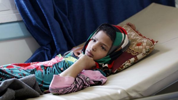 A Yemeni youth suspected of being infected with cholera receives treatment at a hospital in Sanaa on May 25, 2017. (AFP/Mohammed Huwais)