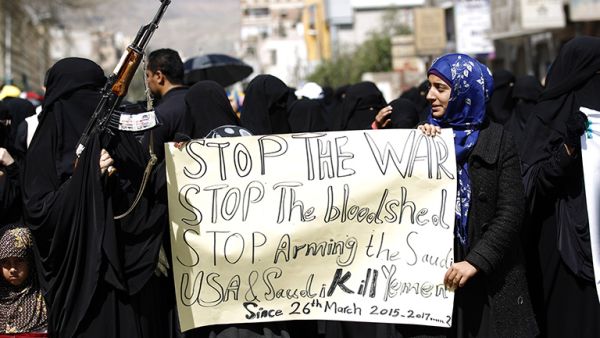 Yemeni women hold placards at a protest outside the Saudi embassy in Sanaa, Yemen, on March 18, 2017. (AFP/Mohammed Huwais)
