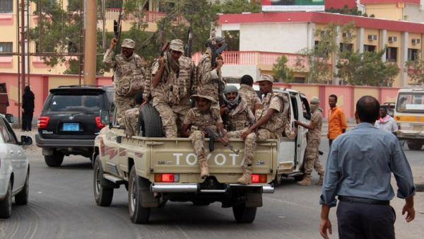 Loyalist forces drive on a main road in the Mansoura residential district of Yemen's second city of Aden after they pushed Al-Qaeda out of parts of the southern city on March 30, 2016. (Saleh al-Obeidi)
