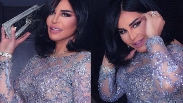 اختارت أحلام لإطلالتها فستان باللون الفضي الضارب على بنفسجي