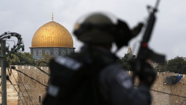 A member of the Israeli security forces stands guard near Jerusalem's Al Aqsa mosque complex.  Writing of his upbringing in Jewish schools in the U.S., David Galdi recalls being kept in the dark about Israel's treatment of Palestinians.  (AFP/Ahmad Gharabli)