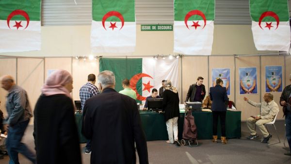Algerians vote at a polling station in France on April 12, 2014.  (AFP/Bertrand Langlois)