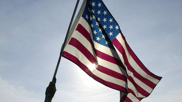 A man waves an American flag (AFP/File Photo)	
