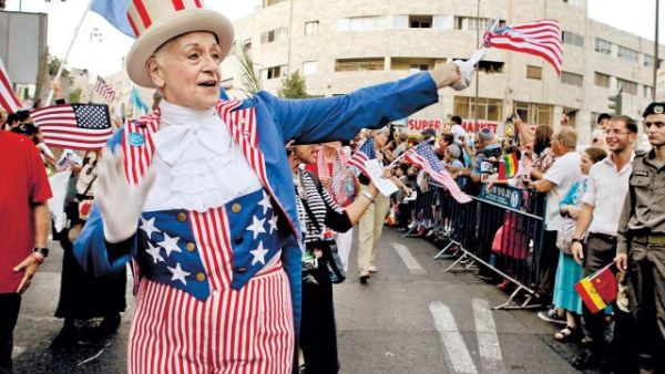 An American Christian pilgrim takes part in a Jerusalem parade celebrating the Jewish holiday Sukkot.  (AFP/File)