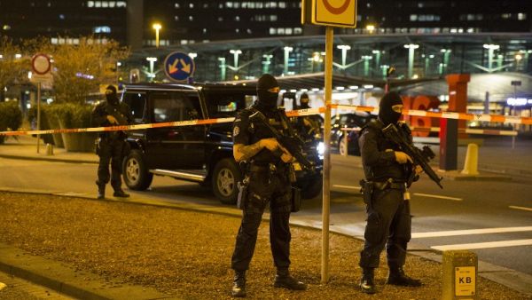 Dutch policemen stand guard by a cordoned off area outside Amsterdam's Schiphol Airport late on April 12, 2016, after it was partially evacuated following a security alert, and a person was one arrested, according to official sources. (AFP/Michel van Bergen) Dutch policemen stand guard by a cordoned off area outside Amsterdam's Schiphol Airport late on April 12, 2016, after it was partially evacuated following a security alert, and a person was one arrested, according to official sources. (AFP/Michel van Bergen)