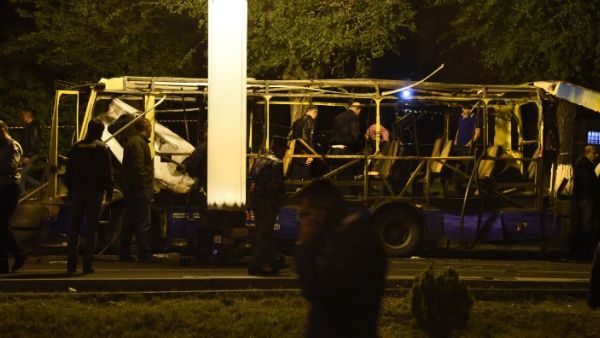 Armenian police investigators work at the site of a bus explosion in Yerevan on April 25, 2016, which killed at least one passenger and wounded six in the Armenian capital Yerevan. (AFP/Karen Minasyan) Armenian police investigators work at the site of a bus explosion in Yerevan on April 25, 2016, which killed at least one passenger and wounded six in the Armenian capital Yerevan. (AFP/Karen Minasyan)