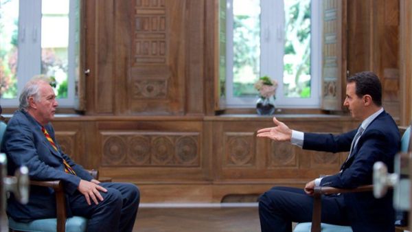 الأسد خلال المقابلة مع صحفي من وكالة الأنباء الفرنسية- أ ف ب
