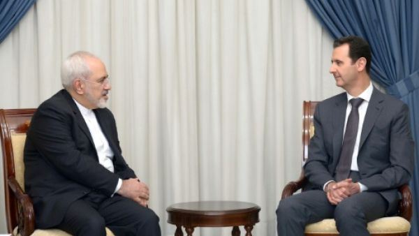 وزير الخارجية الايراني محمد جواد ظريف خلال لقائه الرئيس السوري بشار الاسد في دمشق