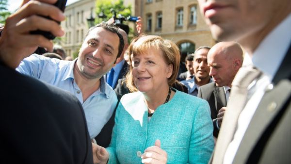 Apparently, Angela Merkel's accomplishments are best told in Iraqi song and screen tees. (AFP/File)