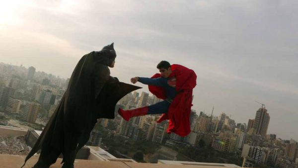 Beirut becomes Gotham city for a day as Batman and Superman battle it out on the rooftops in April 2016.  (AFP/Patrick Baz)
