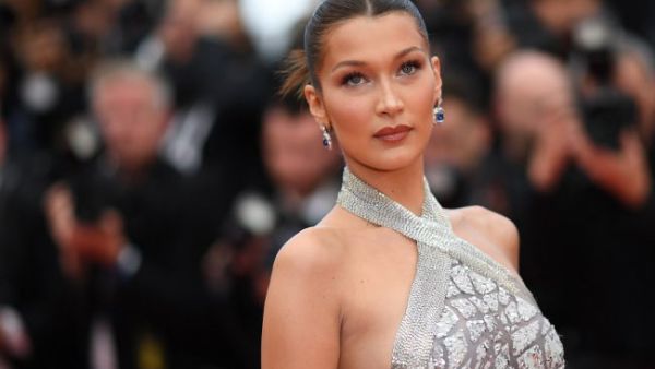 Bella Hadid  seemed to share all the same features as long-lost twin Carla Bruni (Source:LOIC VENANCE/ AFP)