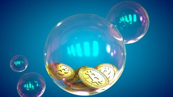 Bitcoin has all the hallmarks of a speculative bubble but the global economy will be fine even if it bursts, analysts say. (Shutterstock)