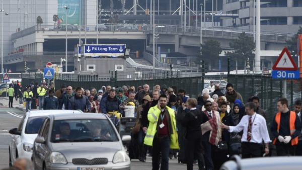 Passengers are evacuated from Brussels airport, on March 22, 2016 in Zaventem, after at least 13 people were killed and 35 injured as twin blasts rocked the main terminal of Brussels airport. (AFP/John Thys) Passengers are evacuated from Brussels airport, on March 22, 2016 in Zaventem, after at least 13 people were killed and 35 injured as twin blasts rocked the main terminal of Brussels airport. (AFP/John Thys)