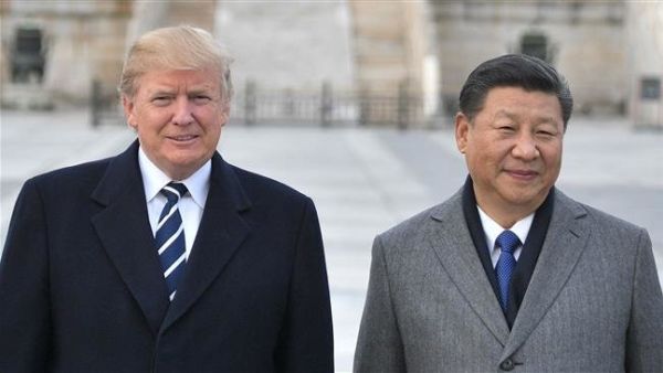 US President Donald Trump (L) and Chinese President Xi Jinping pose at the Forbidden City in Beijing.(AFP/File)