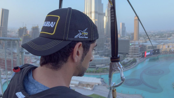 The video of Shaikh Hamdan riding a zip-line suspended above Downtown Dubai, with Burj Khalifa in the background, was posted on his Instagram page on Saturday evening. (Instagram)