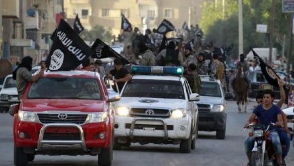 Daesh militants drive through the streets of Raqqa. (AFP/File)