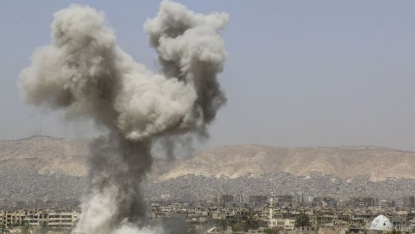 Smoke billows following air strikes by regime forces in the restive Jobar area, in eastern Damascus on April 29, 2015. (AFP/Lens of a Young Dimashqi)