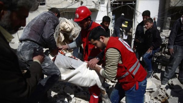 Members of the Syrian Arab Red Crescent and residents search through the rubble for bodies following an airstrike in the rebel-held city of Douma in Eastern Ghouta, on February 26, 2016. (AFP/Abd Doumany) Members of the Syrian Arab Red Crescent and residents search through the rubble for bodies following an airstrike in the rebel-held city of Douma in Eastern Ghouta, on February 26, 2016. (AFP/Abd Doumany)