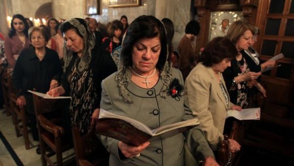 Palestinian Christian Catholics attend an Easter Vigil mass in Gaza City on April 8, 2012. (AFP/Mahmud Hams)