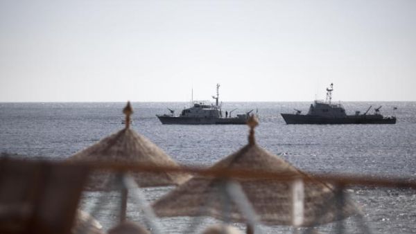 Egyptian navy vessels patrol off the coast of the Red Sea resort city of Sharm el-Sheikh on Feb. 17, 2011. (AFP/Marco Longari)