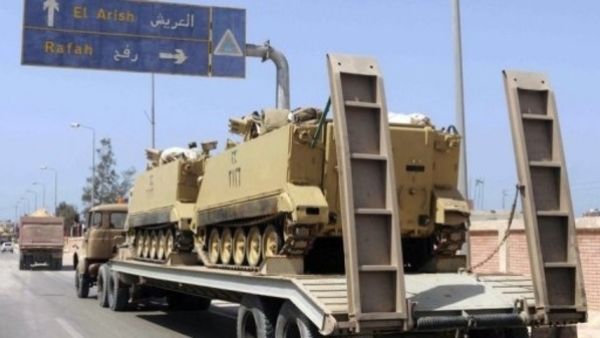 An Egyptian military truck carries armored personnel carriers en route to the Sinai Peninsula. (AFP/File)