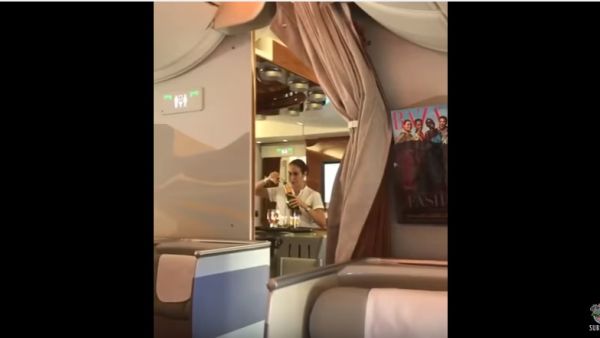 Emirates is so poor that its flight attendants have to pour drinks back into their bottles. (YouTube)