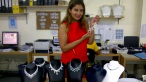 Shatha displaying necklaces