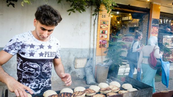 Putting kibbeh on the sidewalk grill outside Bawabat Istanbul (Photo credit: Karim Mostafa)