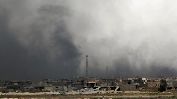 Smoke rises after a US-led coalition airstrike in southern Fallujah. (AFP/Ahmad Al-Rubaye)