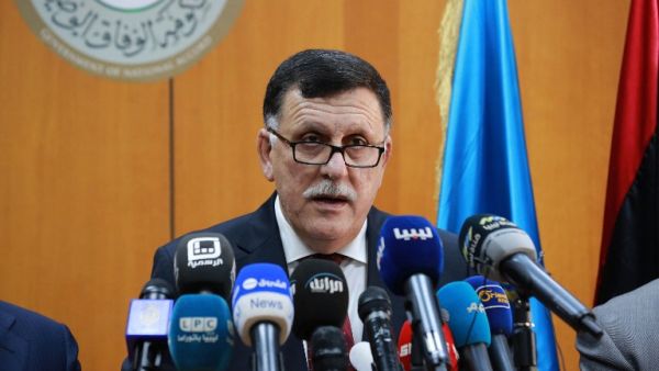 Libya's UN-backed Prime Minister-designate, Fayez al-Sarraj, flanked by members of the presidential council, speaks during a press conference on March 30, 2016 in the capital Tripoli. (AFP/Stringer)