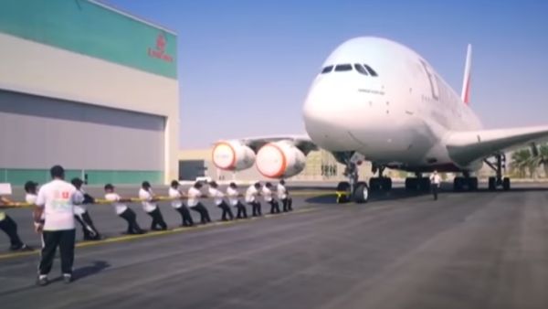 A team from the Dubai Police landed a world record by pulling the superjumbo Emirates A380 plane for around 100 meters (Youtube Screengrab)