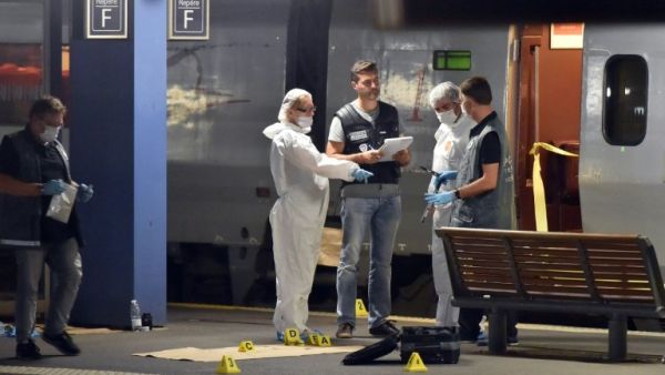 Officials inspect the train following the attack. (AFP/Philippe Huguen)