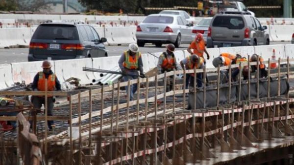 Many such laborers spend the better part of the day cleaning and repairing suspended from platforms several feet above ground