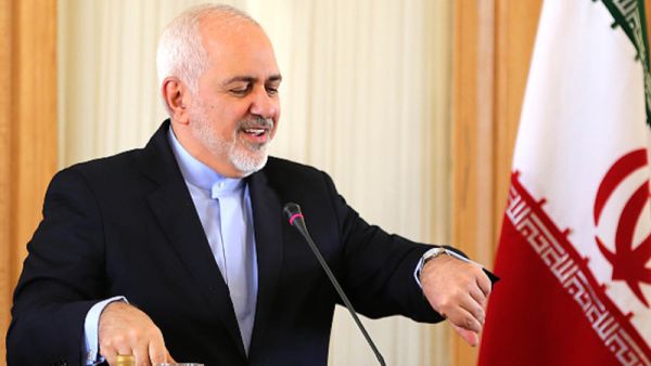 Iranian Foreign Minister Mohammad Javad Zarif checks his watch during a press conference in Tehran on Feb. 13. (AFP/ File Photo)