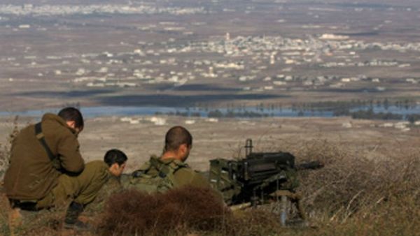 IDF soldiers survey the landscape in the Israeli-occupied Golan Heights. (AFP/File) IDF soldiers survey the landscape in the Israeli-occupied Golan Heights. (AFP/File)
