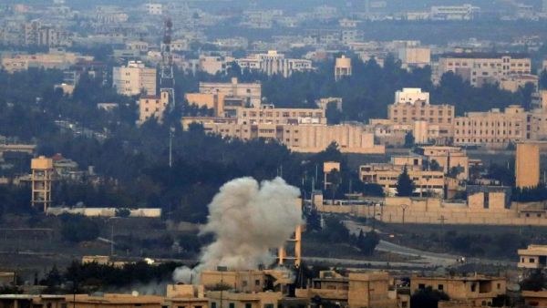 A picture taken on November 18, 2014 from the Israeli-annexed Golan Heights near the Quneitra border crossing with Israel shows smoke billowing from buildings in Syrian territory (AFP Photo/Jalaa Marey)
